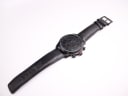 Full length view of the Gucci 126.2 watch laid flat, displaying the dial and strap.