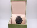 The Gucci 126.2 watch presented within its original green Gucci-branded watch box.