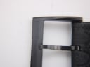 Close-up of the black PVD buckle, clearly showing the embossed "GUCCI" brand name.