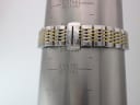 Watch bracelet on a wrist sizing gauge, showing a circumference of approximately 172mm / 17.2cm.