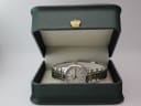 Dreyfuss & Co. watch displayed in a green presentation box with gold crown emblem.