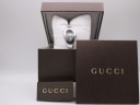 The Gucci 103 watch presented within its original brown Gucci box, accompanied by original Gucci papers.