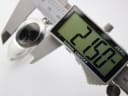 Digital caliper measuring the case diameter of the Gucci 103 watch at 21.57mm.