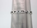 The Gucci 110 bracelet on a wrist sizing cone, indicating a wrist circumference of approximately 16.5cm (165mm).