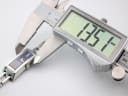 Digital caliper measuring the case width of the Gucci 110 watch, showing a reading of 13.51mm.