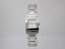 Front view of the Gucci 7900 P watch with a square stainless steel case and integrated bracelet on a plain background.