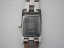 Close-up of the stainless steel case back, engraved with Tissot 1853 logo, model T042109 A, serial, sapphire crystal, and 30m water resistance.