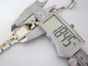 Digital caliper measuring the watch case, showing a width of 18.95 mm.