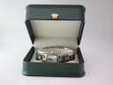 The Tissot watch presented in a generic green display box (not original manufacturer's packaging).