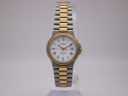 Front view of the Tissot Seastar D 311 watch, showcasing its white dial with roman numerals and two-tone bracelet.