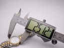 Digital caliper measuring the case diameter of the Tissot Seastar D 311, showing a precise reading of 25.12mm.