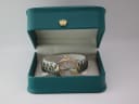 The Tissot PR 50 watch presented in a green leatherette display box with a gold crown emblem.