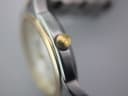 Detailed close-up of the gold-plated Tissot crown with its distinctive 'T' logo.