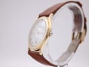 Side view of the Mappin & Webb watch showing the polished gold tone case and crown.