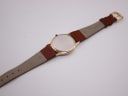 Rear view of the Mappin & Webb watch showing the plain case back and underside of the brown leather strap with 20mm lug width mark.