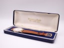 The Mappin & Webb watch in its open original blue box, showing brand name on lid lining.