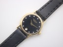 Close-up front view of Raymond Weil 9923 watch with black dial, diamond markers, gold hands and date window