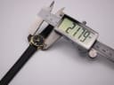 Digital caliper measuring the watch case diameter at 21.79mm