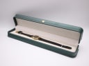 Raymond Weil watch displayed open in a green leatherette presentation box