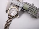 Digital caliper measuring the case diameter of the Accurist watch at 38.01mm.