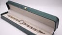 The Bulova watch presented in a green leatherette display box.