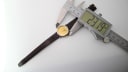 Top-down view of the Tissot C226K watch with a digital caliper measuring the case diameter as 27.19mm, showing the brown leather strap.