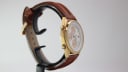 Opposite side view of the Seiko 7T32-7R3A watch on a display stand, focusing on the case profile and strap attachment.