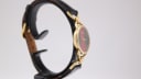 Another side view of the Gucci watch, showcasing the slim profile and case details.