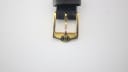 Close-up of the gold-toned buckle, clearly showing the engraved Gucci interlocking G logo.