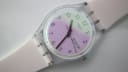 Close-up top-down view of the Swatch Day-Date dial, showing iridescent effect and day-date complication.