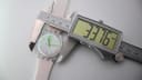 Digital caliper measuring the Swatch Day-Date case diameter as 33.76mm.