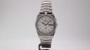 Front view of the Seiko 7223-6010 quartz watch with white dial and integrated stainless steel bracelet.