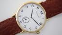 Front view of Mappin & Webb gold-plated watch, white dial, black Arabic numerals, and sub-seconds at 6 o'clock.