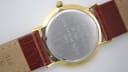 Close-up of the stainless steel case back with "R.C. THOMPSON 15 year Award Long Service 1993" engraving, and watch serial number.