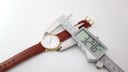 Digital caliper measuring the Mappin & Webb watch case diameter at 32.46mm.