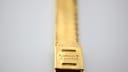 Detailed close-up of the gold-tone bracelet clasp, showing the engraved text 'PL OR GALV 10 MICRONS'.