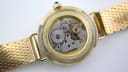 Open case back revealing the mechanical manual wind movement, clearly showing 'seventeen jewels' engraving.