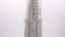 Tissot watch bracelet on a sizing cone, indicating a wrist size of approximately 16.5cm.