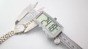 Digital caliper measuring the case diameter of the Tissot watch, showing 24.18mm.