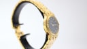 Oblique side view of the Tissot Stylist watch on a display stand, showcasing the case and bracelet.