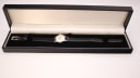 The Bucherer watch displayed inside its black presentation box with a white satin-lined interior.
