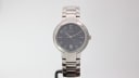 Front view of the Gucci 8900 M men's quartz watch with a grey dial and stainless steel integrated bracelet, presented on a white background.