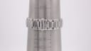 The stainless steel integrated bracelet of the Gucci 8900 M watch on a wrist sizing cone, showing a circumference measurement of 198mm or 19.8cm.