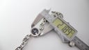 Digital caliper measuring the case diameter of the Gucci G-Gucci watch, displaying a precise reading of 21.69mm.
