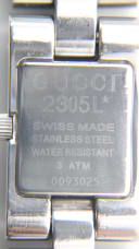 Case back engraving of the Gucci 2305L, showing model number, "SWISS MADE", "STAINLESS STEEL", "WATER RESISTANT 3 ATM", and serial number 0093025.
