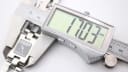 Digital caliper measuring the case thickness of the Gucci 2305L, showing a reading of 17.03mm.