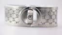 Close-up of the watch case from the side, revealing the Gucci-signed crown.