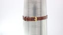 Close-up of the Raymond Weil 310 watch strap buckled on a wrist sizing gauge, showing a wrist circumference of 17.2cm.