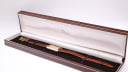 Raymond Weil 310 watch displayed in a brown presentation box.