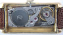 Detailed close-up of the Raymond Weil 310 manual wind movement inside the case, showing gears and jewels.